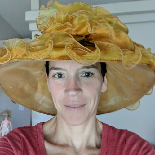 Ren wearing a dramatic golden hat that could definitely pass for a Blorb crown